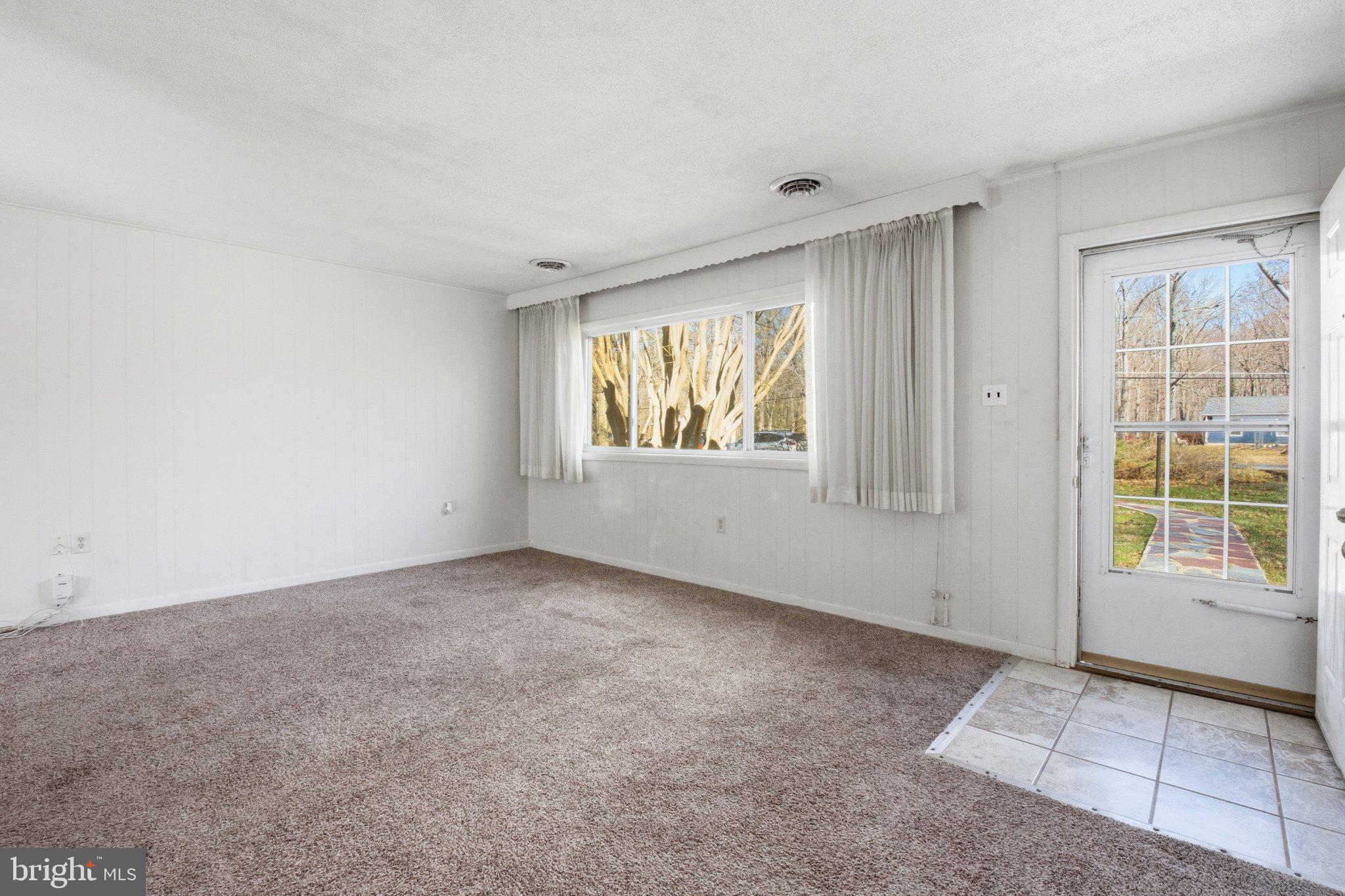 1469 Cedarhurst Road Shady Side, MD 20764 - Photo 5 of 19 an empty room with windows