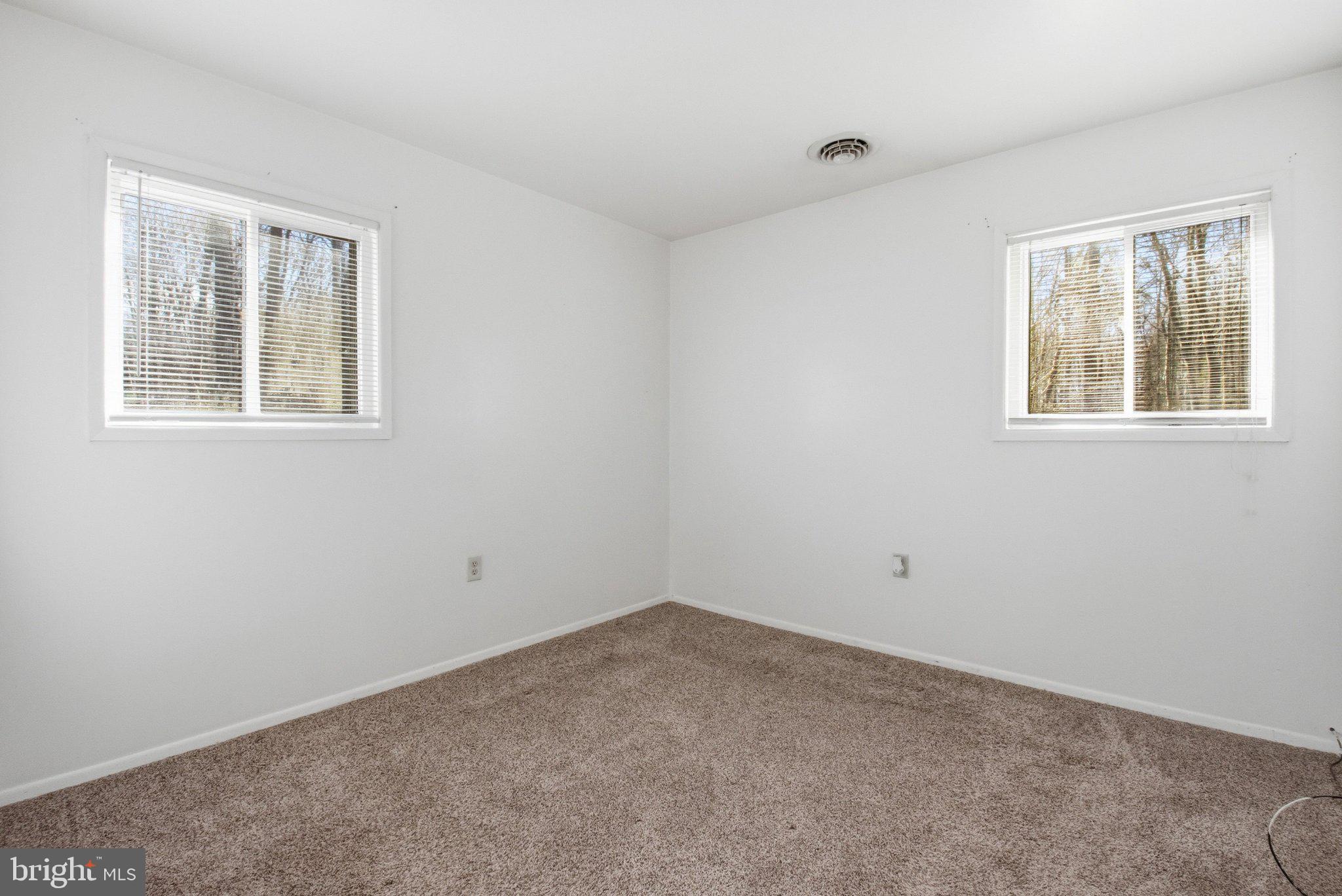 1469 Cedarhurst Road Shady Side, MD 20764 - Photo 10 of 19 an empty room with windows