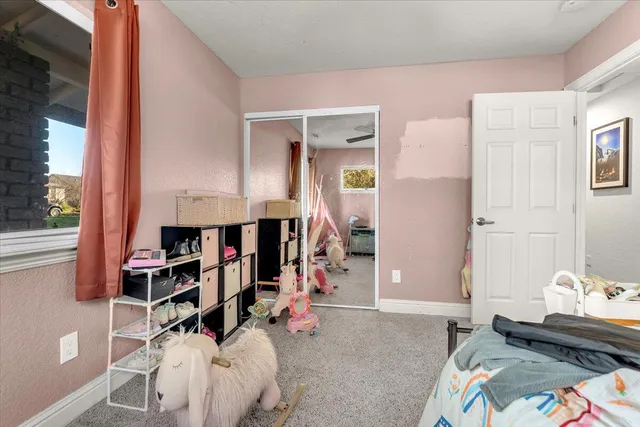 a bed room with a bed and a window