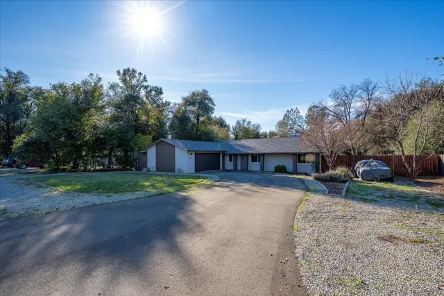 an aerial view of a residential houses with outdoor space and street view