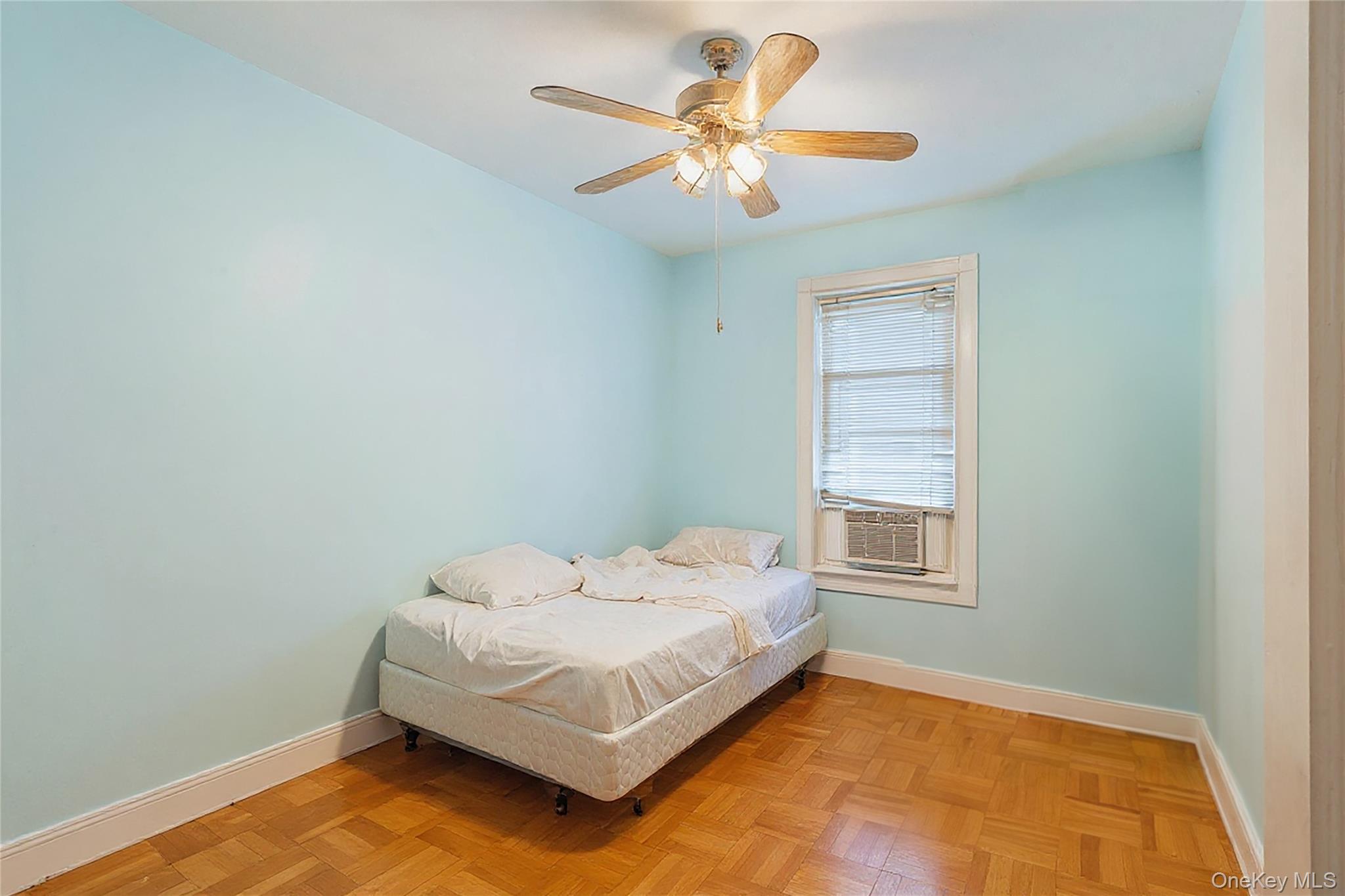 1527 East 29th Street Brooklyn, NY 11229 - Photo 9 of 22 Bedroom with ceiling fan and cooling unit