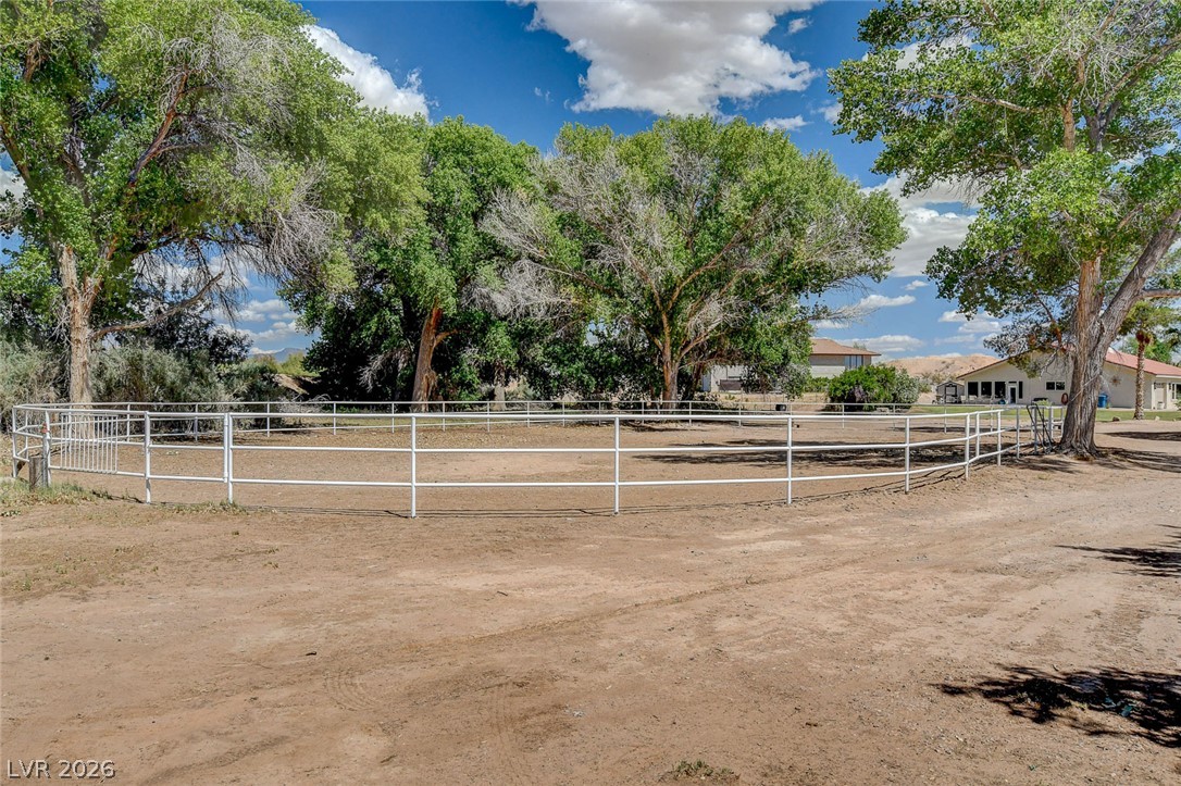 1950 Bowman Road Logandale, NV 89021 - Photo 3 of 98 A spacious, fenced corral awaits your equestrian pursuits under a vast, open sky.