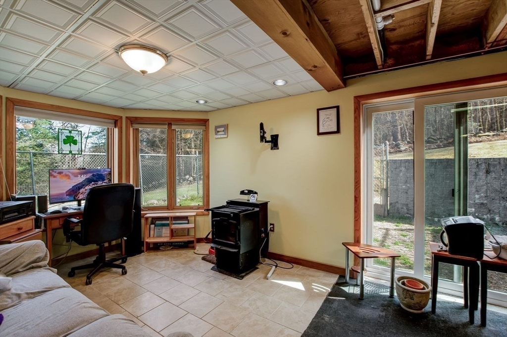 205 East Rindge Road Ashburnham, MA 01430 - Photo 38 of 40 a view of a livingroom with workspace and windows