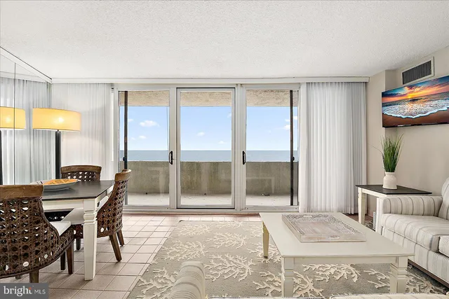 a bedroom with furniture and a large window