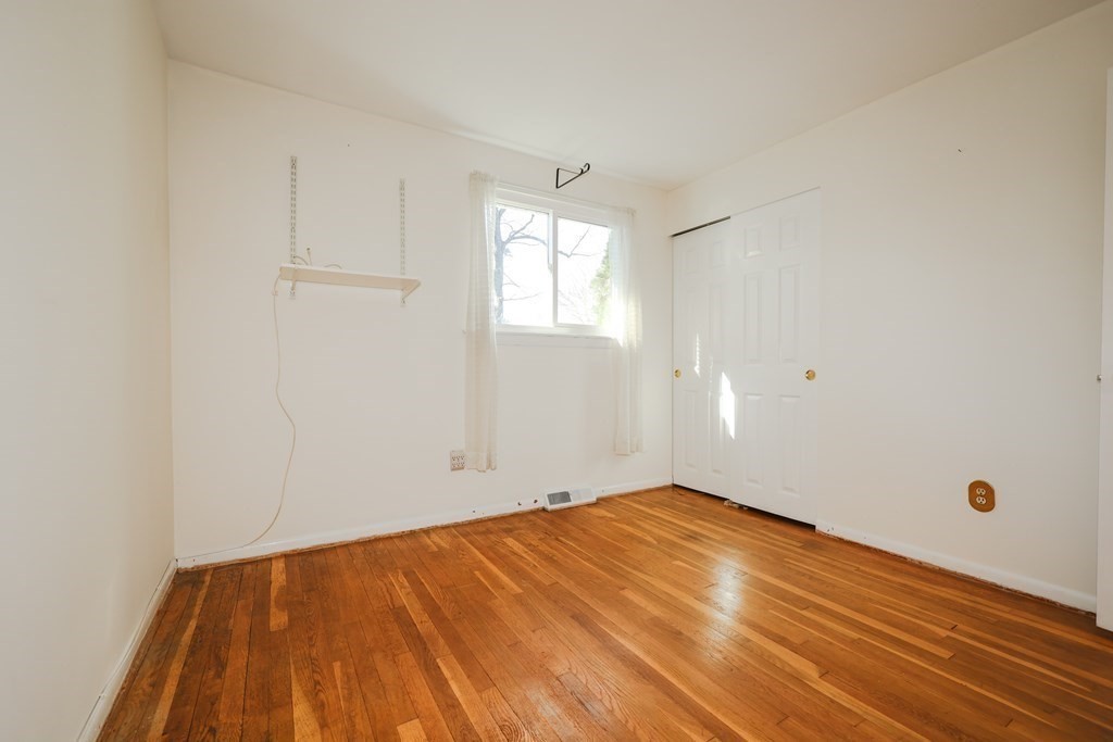 354 Gorwin Drive Holliston, MA 01746 - Photo 14 of 25 a view of empty room with wooden floor