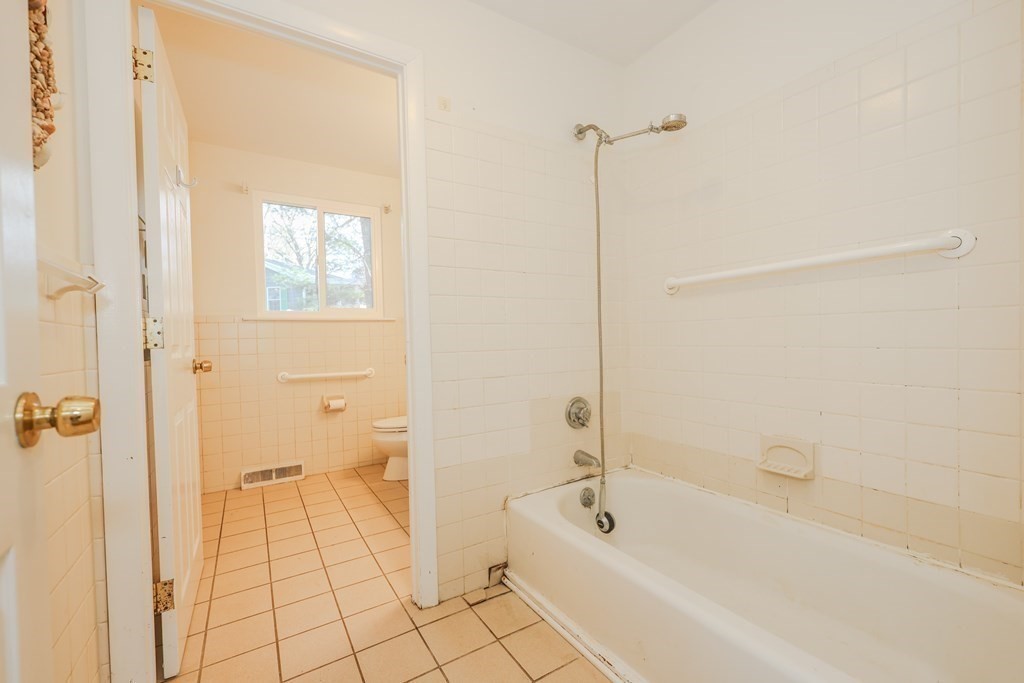 354 Gorwin Drive Holliston, MA 01746 - Photo 18 of 25 a bathroom with a bathtub a toilet and a shower