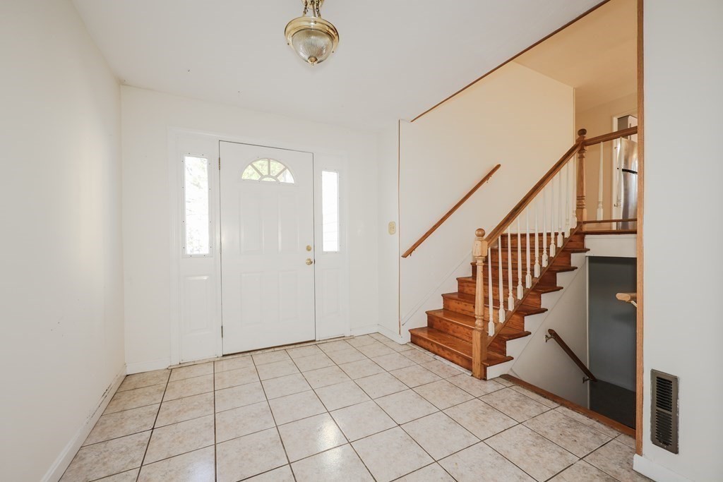 354 Gorwin Drive Holliston, MA 01746 - Photo 19 of 25 a view of an entryway with stairs