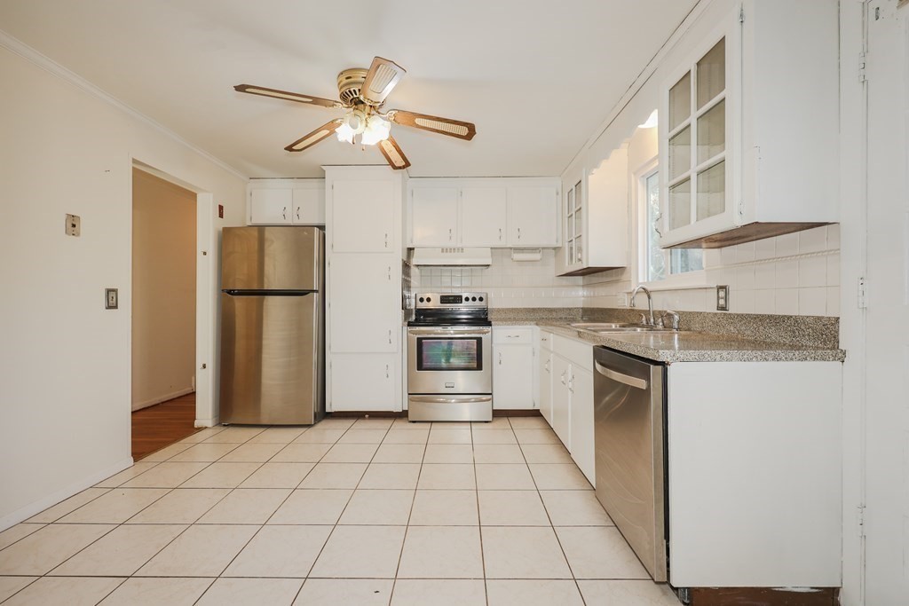354 Gorwin Drive Holliston, MA 01746 - Photo 5 of 25 a kitchen with a refrigerator a sink and dishwasher