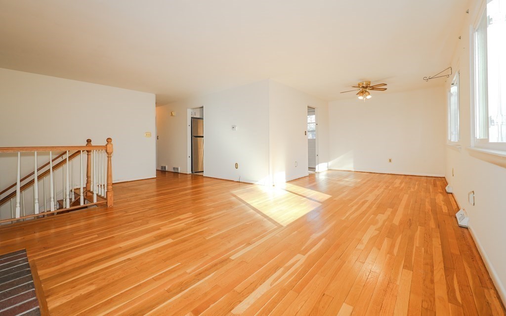 354 Gorwin Drive Holliston, MA 01746 - Photo 7 of 25 a view of a room with wooden floor and fan