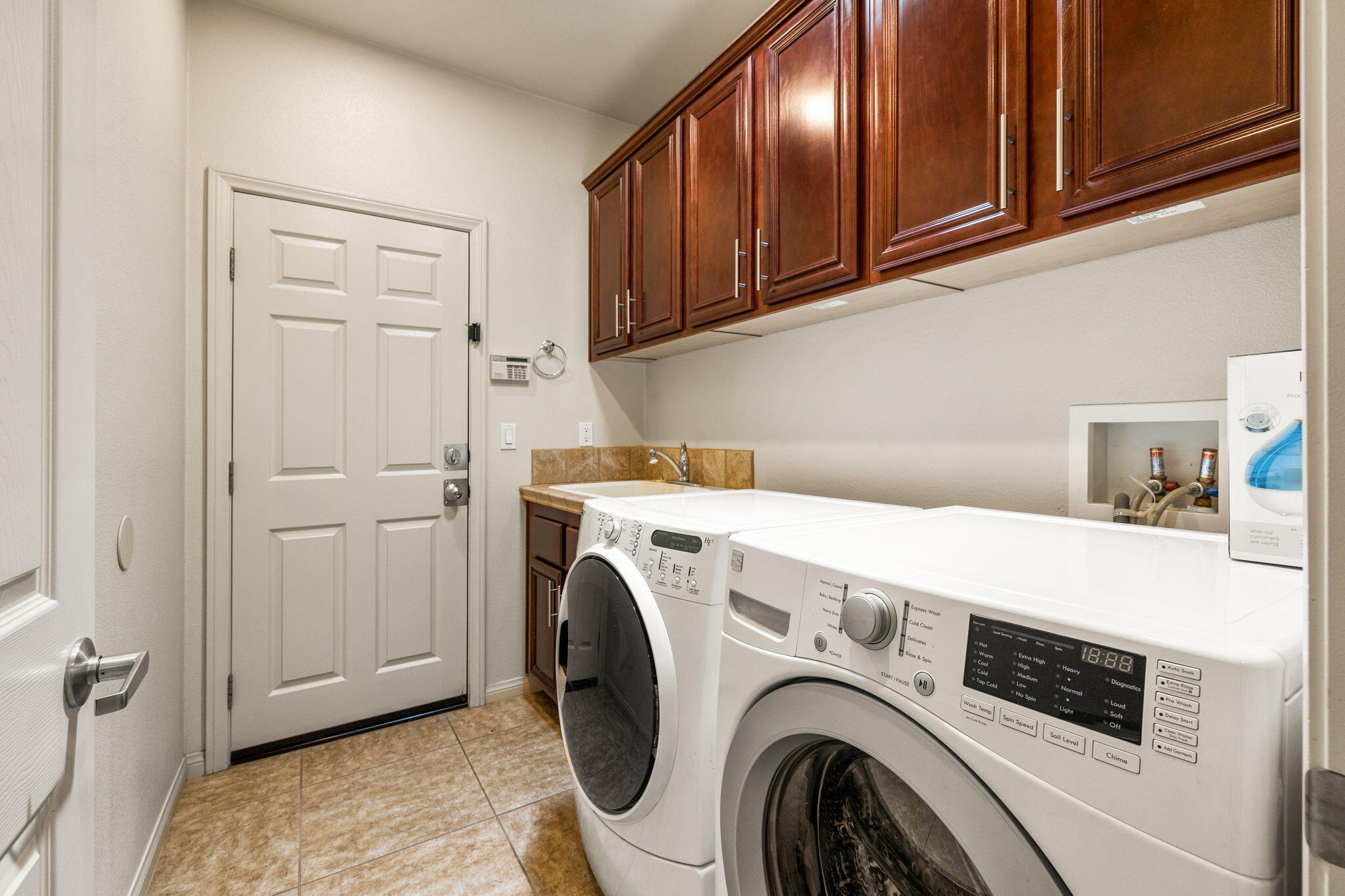 83725 Himalaya Drive Indio, CA 92203 - Photo 14 of 45 a utility room with dryer and washer