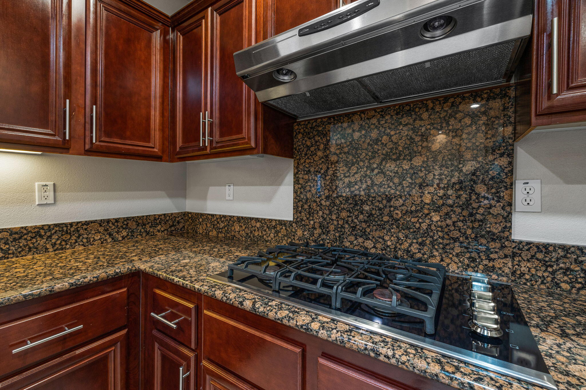 83725 Himalaya Drive Indio, CA 92203 - Photo 17 of 45 a kitchen with granite countertop a stove and a sink