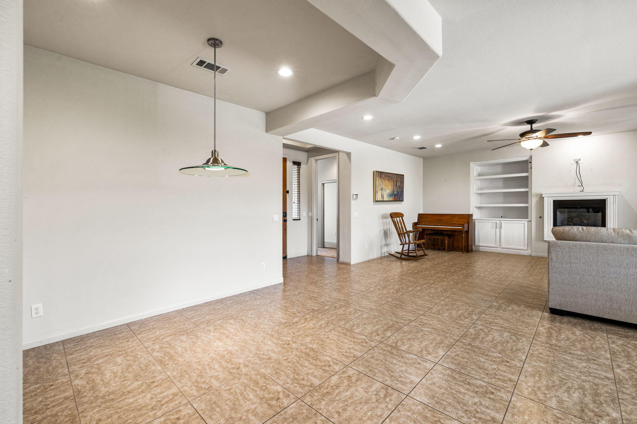 83725 Himalaya Drive Indio, CA 92203 - Photo 20 of 45 a view of a livingroom with furniture and a ceiling fan