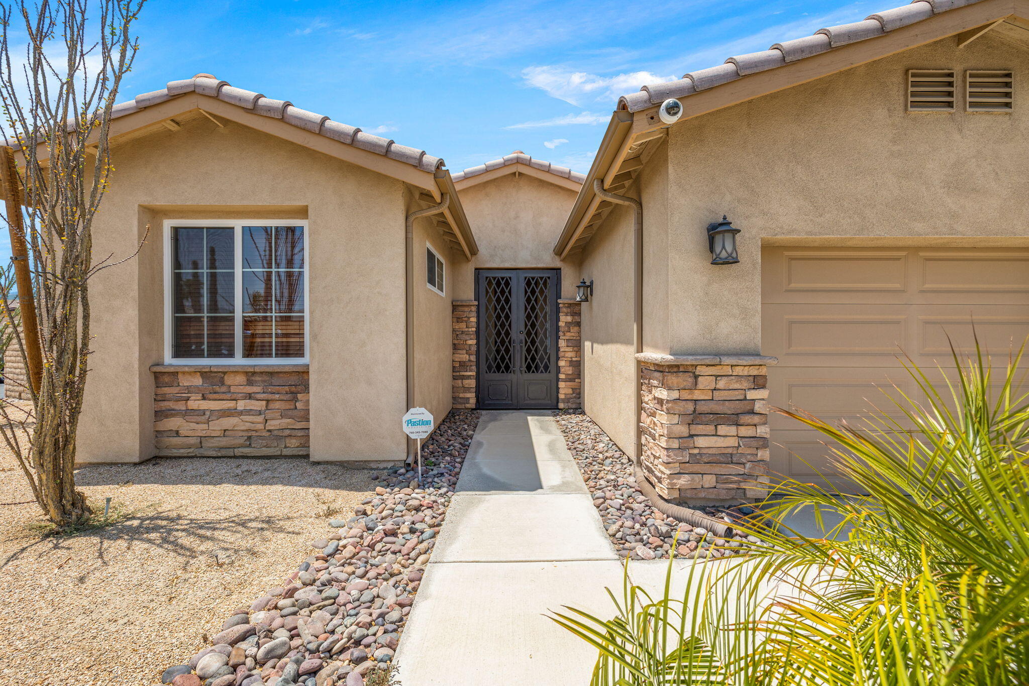 83725 Himalaya Drive Indio, CA 92203 - Photo 2 of 45 a front view of a house