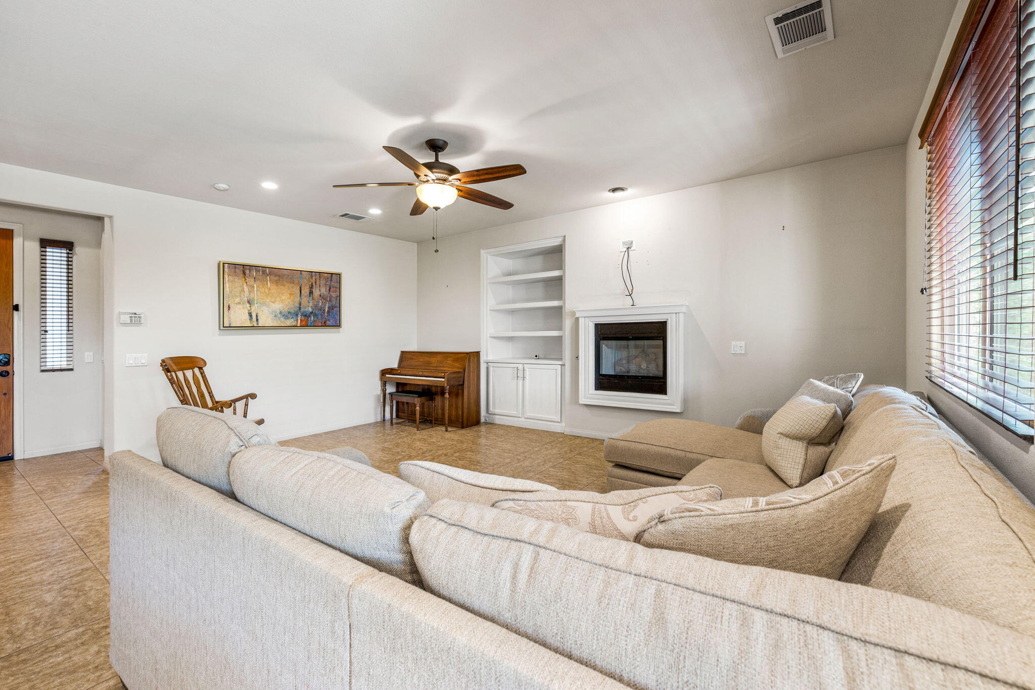 83725 Himalaya Drive Indio, CA 92203 - Photo 28 of 45 a living room with furniture and a flat screen tv