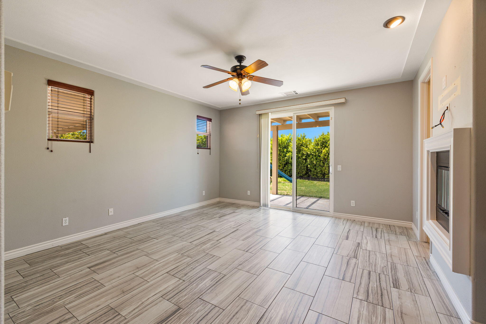 83725 Himalaya Drive Indio, CA 92203 - Photo 3 of 45 a view of room with window ceiling fan and hardwood floor