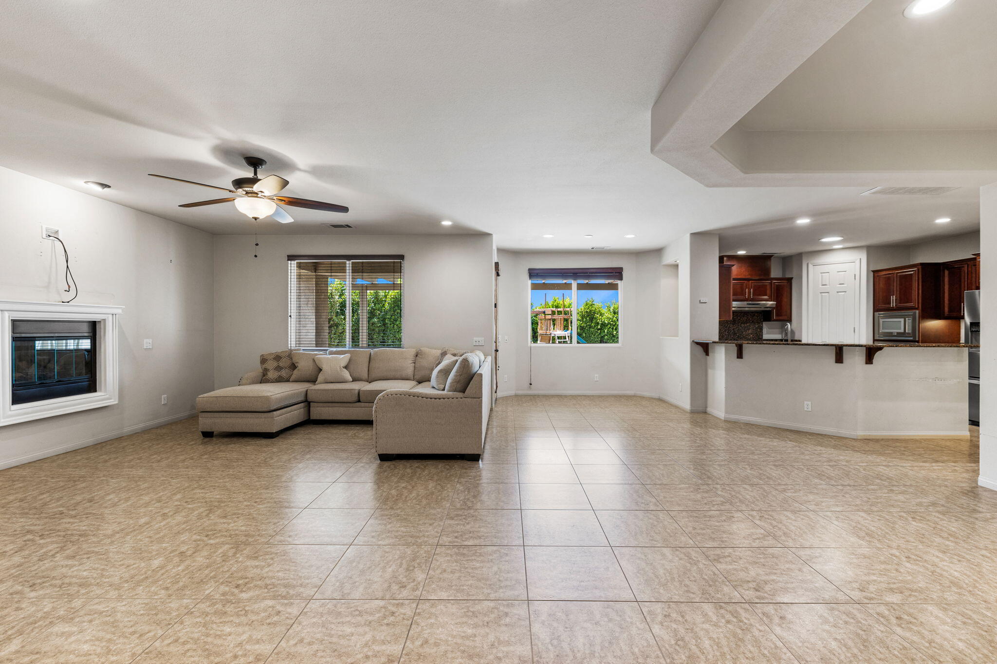 83725 Himalaya Drive Indio, CA 92203 - Photo 33 of 45 a living room with furniture and a fireplace
