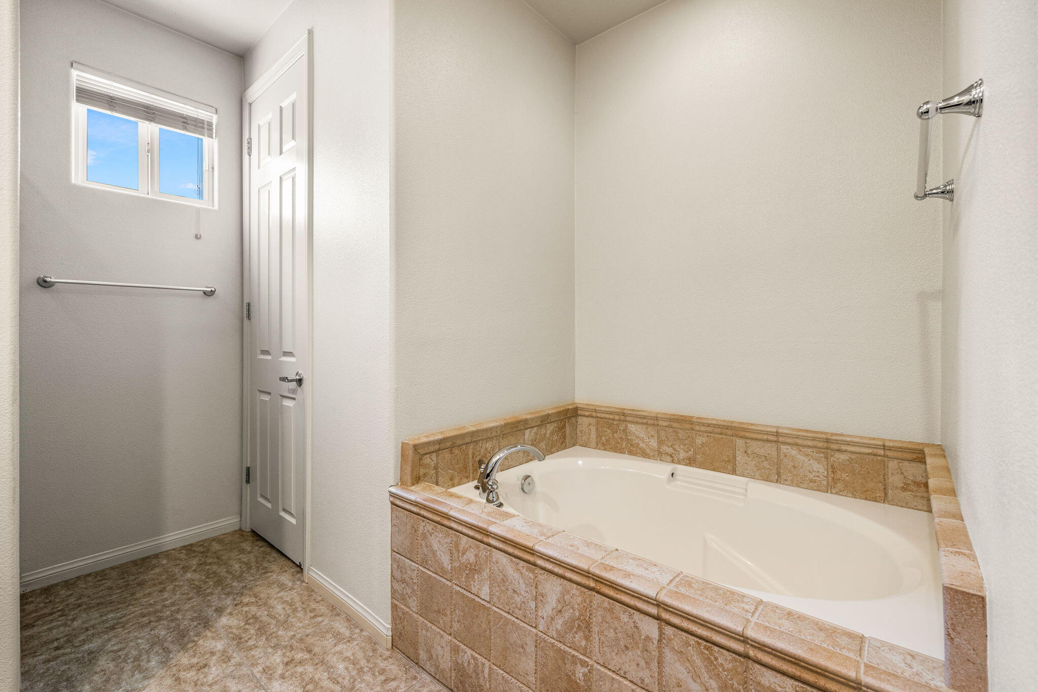 83725 Himalaya Drive Indio, CA 92203 - Photo 7 of 45 a white bath tub sitting in a bathroom