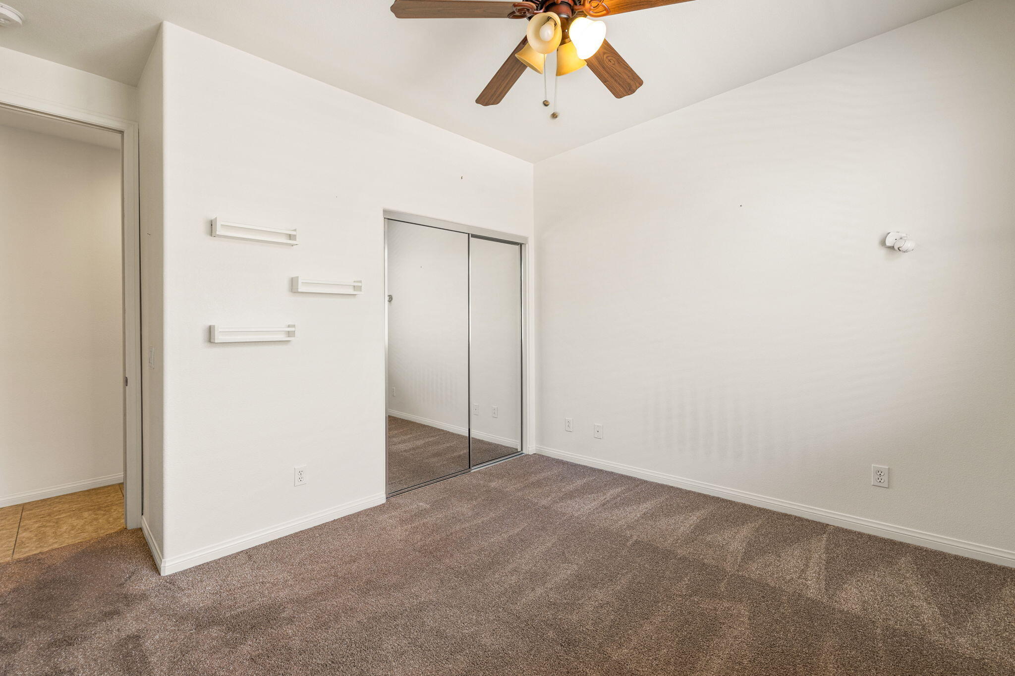 83725 Himalaya Drive Indio, CA 92203 - Photo 10 of 45 an empty room with chandelier fan