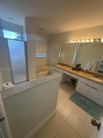 a room with a sink and cabinets