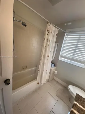 a bathroom with a tub and a shower