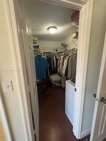 a view of a hallway with storage