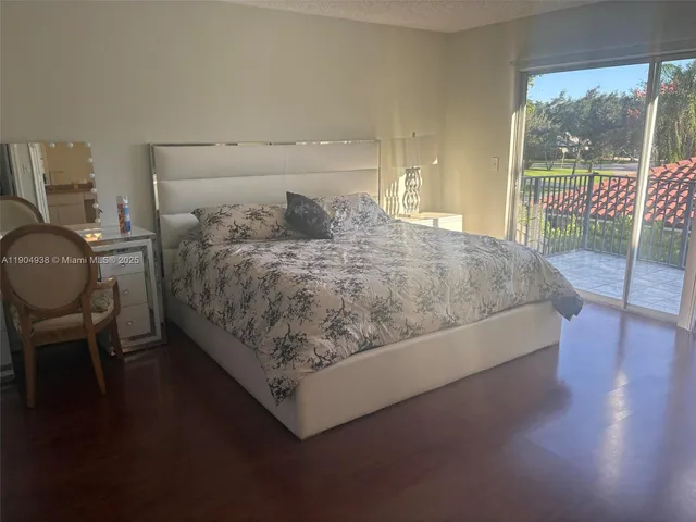 a bed sitting in a room next to a window