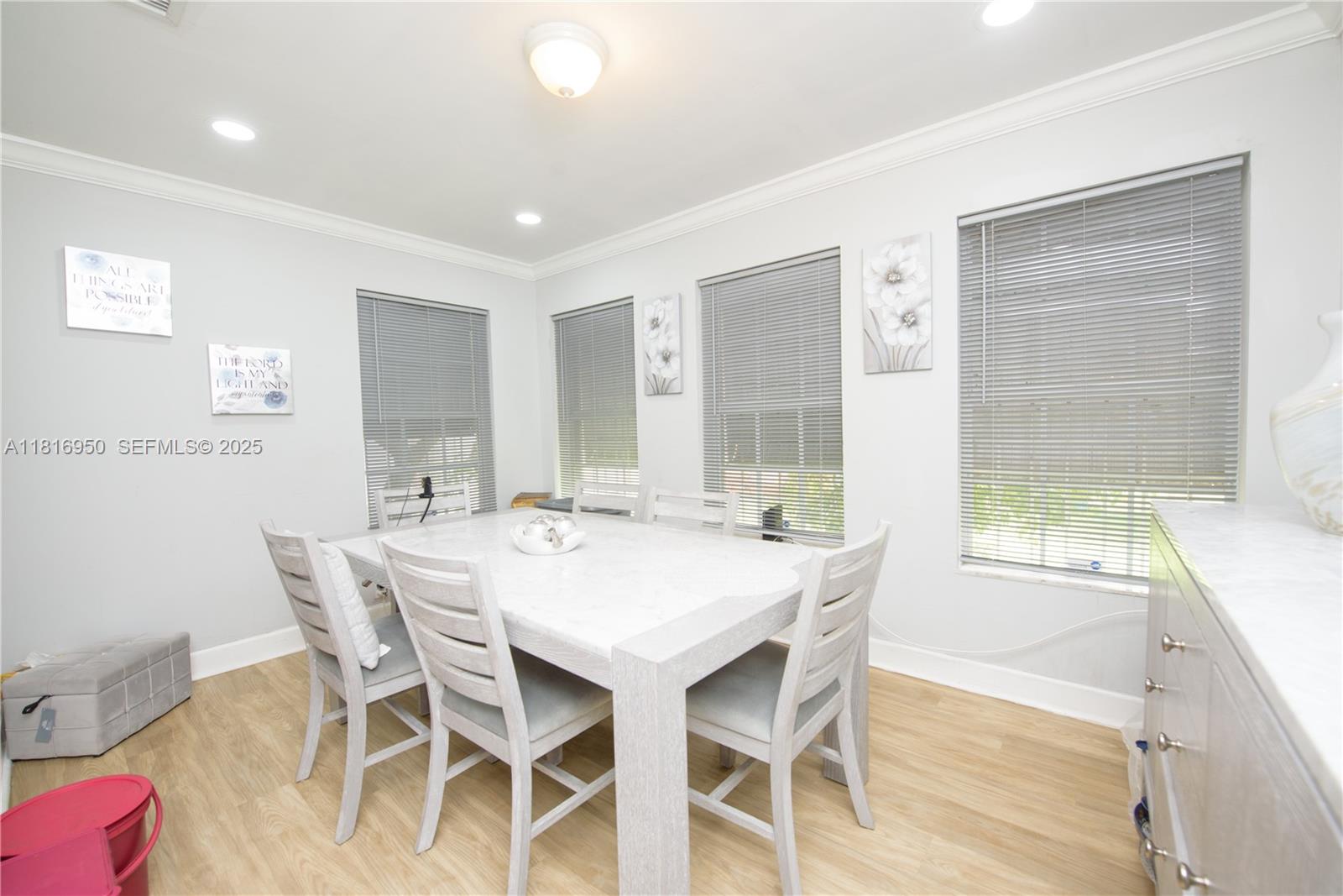916 Northwest 3rd Avenue Homestead, FL 33030 - Photo 12 of 35 a view of a dining room with furniture and wooden floor