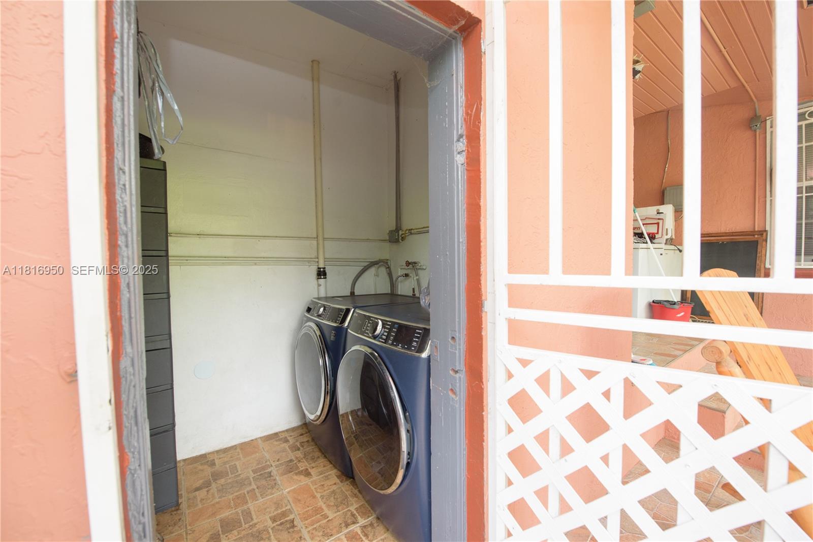 916 Northwest 3rd Avenue Homestead, FL 33030 - Photo 13 of 35 a view of bathroom with washer and dryer