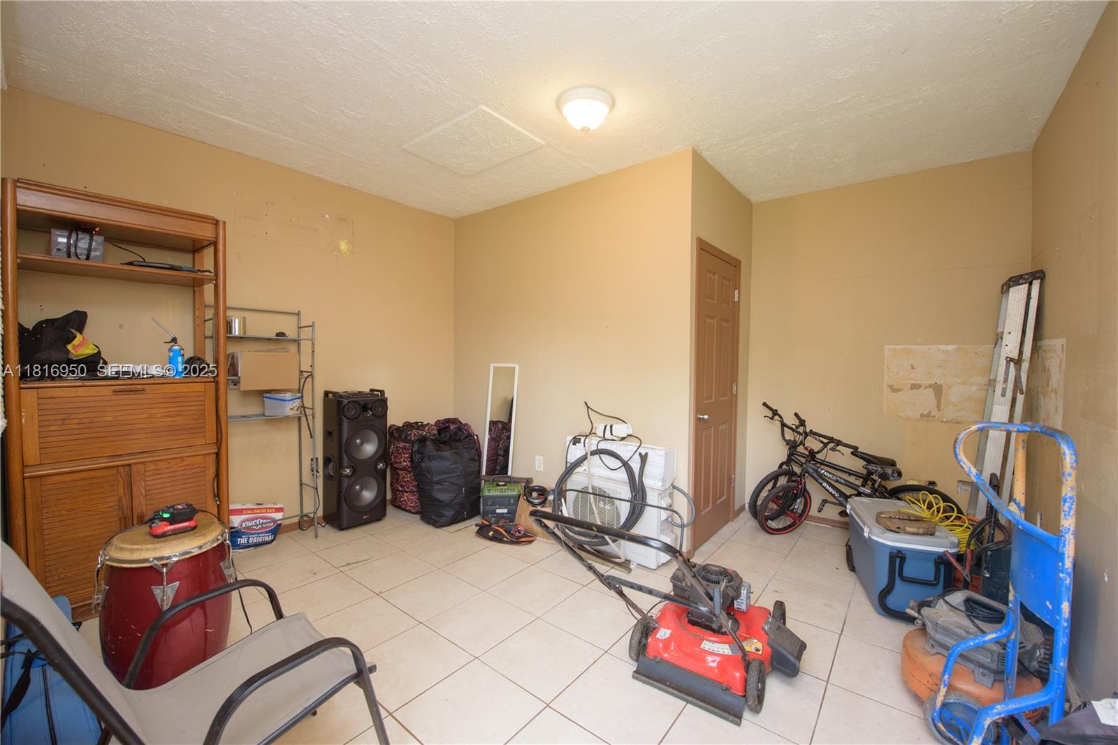 916 Northwest 3rd Avenue Homestead, FL 33030 - Photo 15 of 35 a view of a room with gym equipment