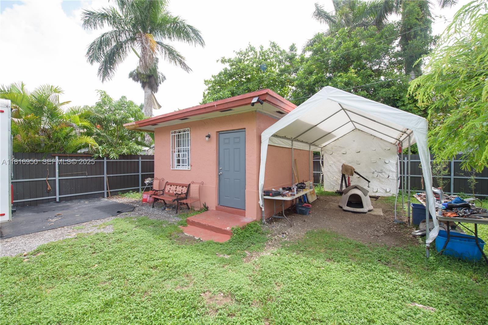 916 Northwest 3rd Avenue Homestead, FL 33030 - Photo 16 of 35 a view of a chair and table in backyard of the house