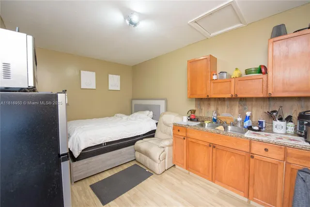 a bed room with a bed and a television