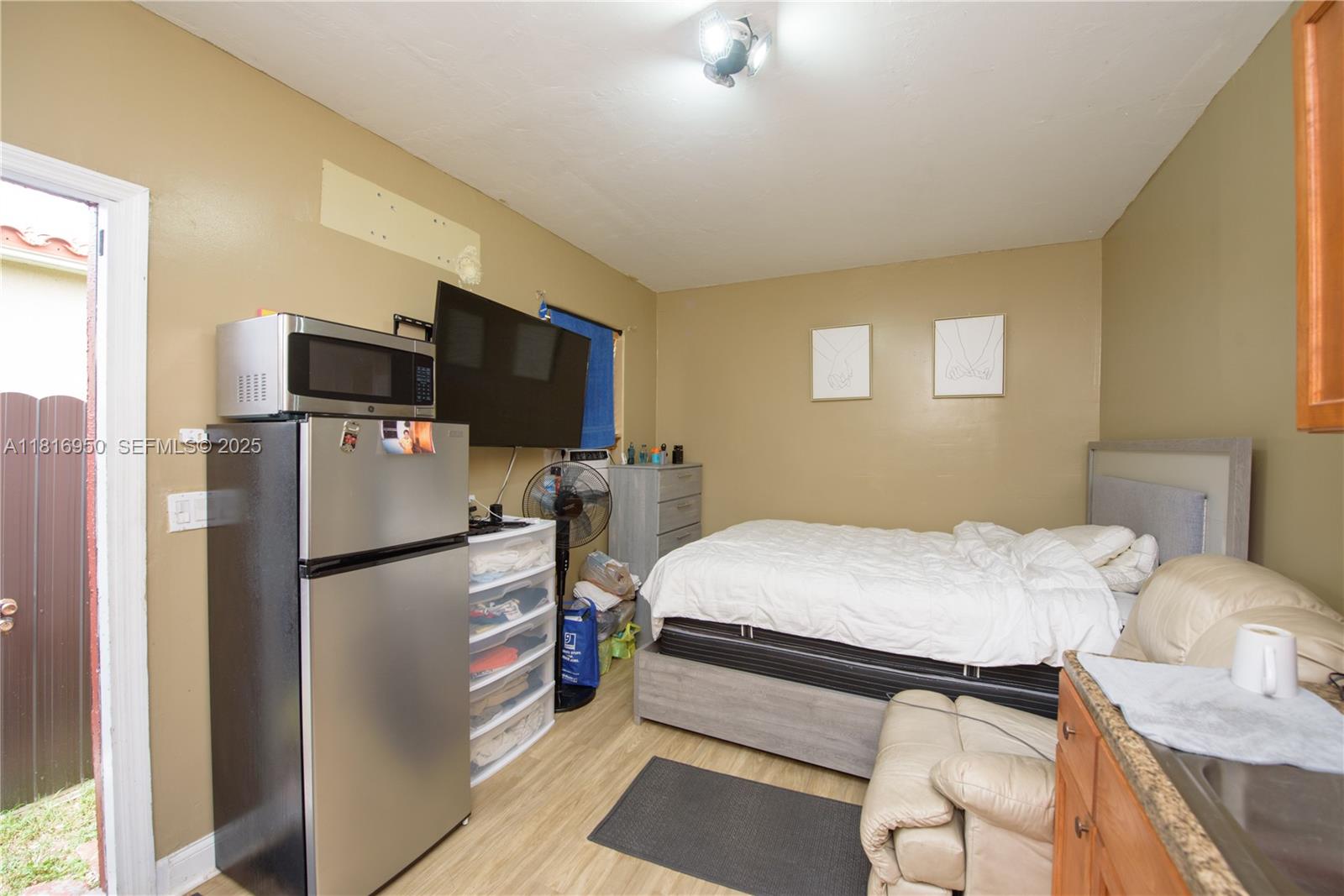 916 Northwest 3rd Avenue Homestead, FL 33030 - Photo 19 of 35 a bed room with a bed and a television