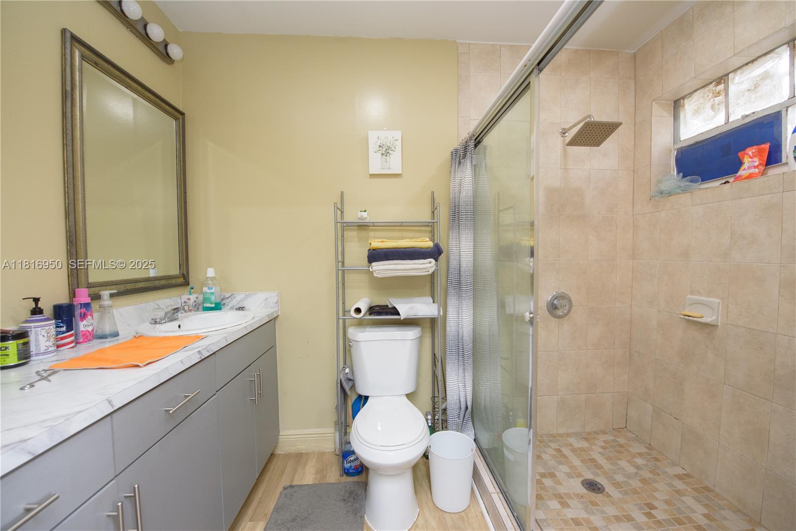 916 Northwest 3rd Avenue Homestead, FL 33030 - Photo 20 of 35 a bathroom with a sink toilet and shower