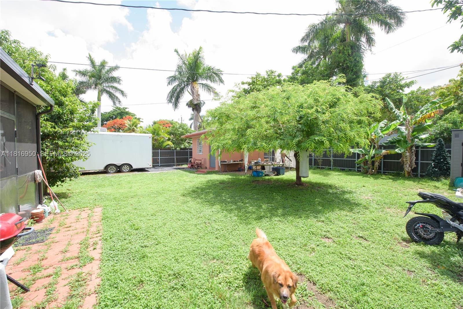 916 Northwest 3rd Avenue Homestead, FL 33030 - Photo 22 of 35 a view of a house with backyard and sitting area