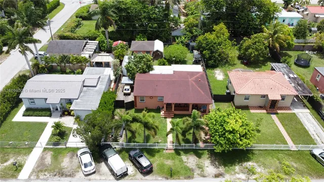 an aerial view of house with yard