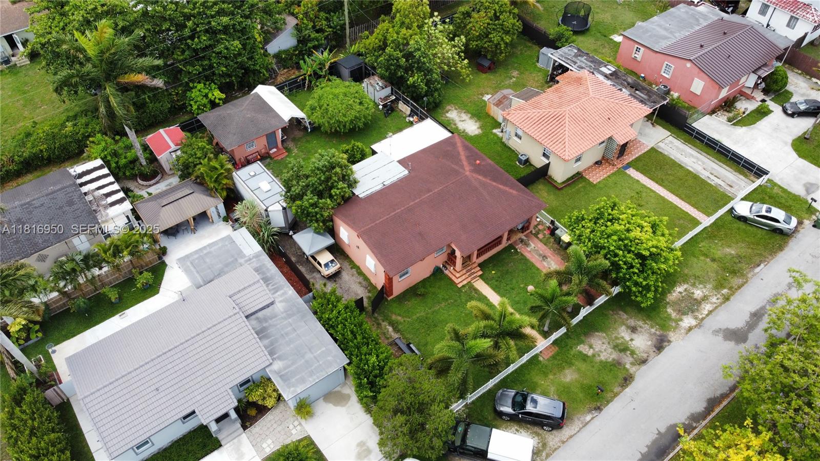 916 Northwest 3rd Avenue Homestead, FL 33030 - Photo 32 of 35 an aerial view of a house with garden space and street view