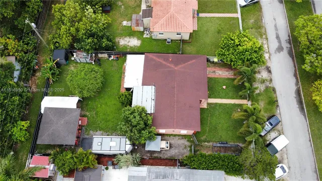 an aerial view of house with yard