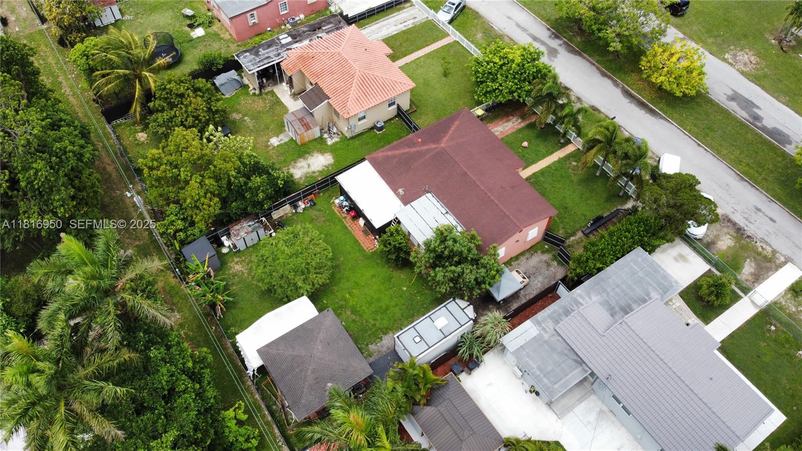 916 Northwest 3rd Avenue Homestead, FL 33030 - Photo 35 of 35 an aerial view of a house with garden space and street view