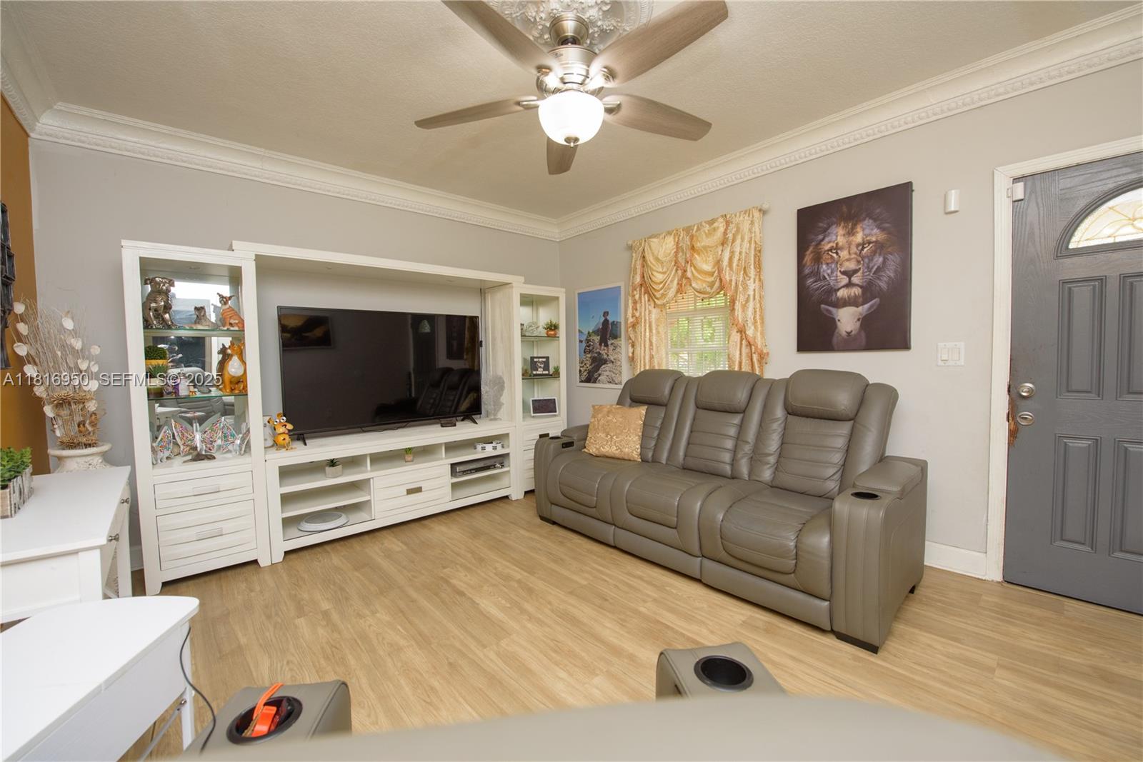 916 Northwest 3rd Avenue Homestead, FL 33030 - Photo 4 of 35 a living room with furniture and a flat screen tv