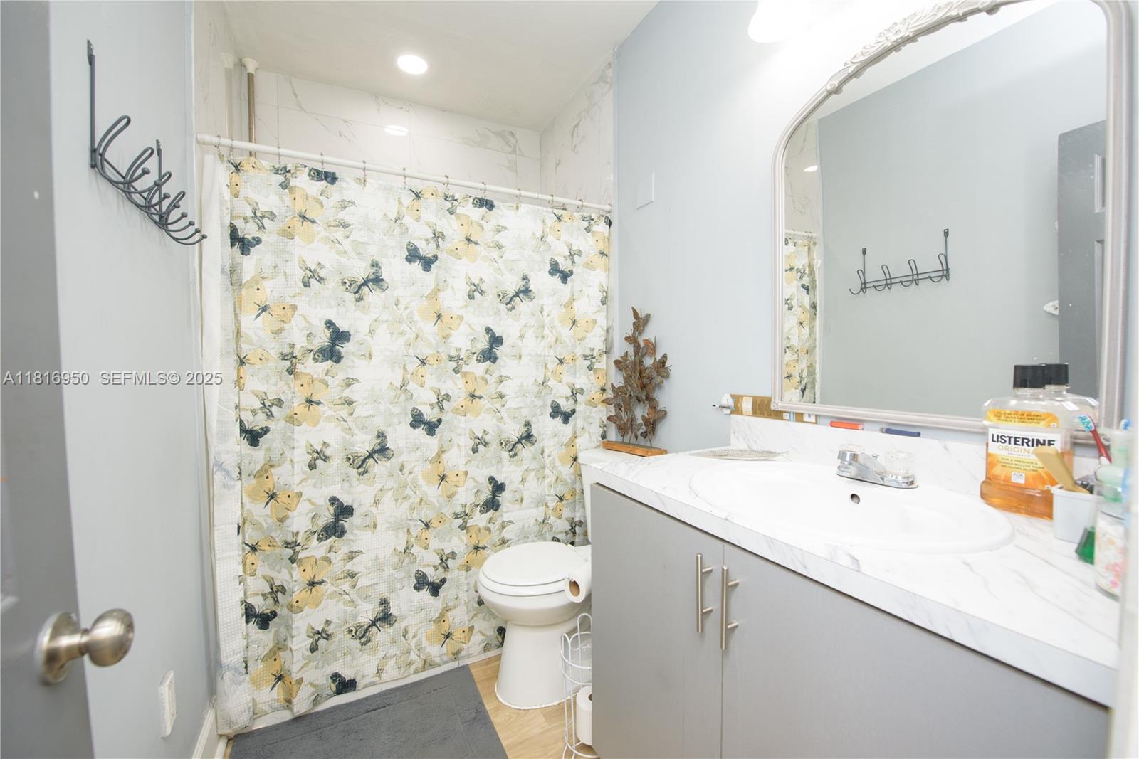916 Northwest 3rd Avenue Homestead, FL 33030 - Photo 5 of 35 a bathroom with a sink toilet and shower