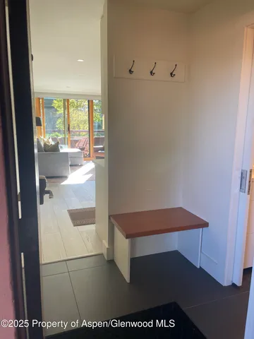 a room with a table and a potted plant