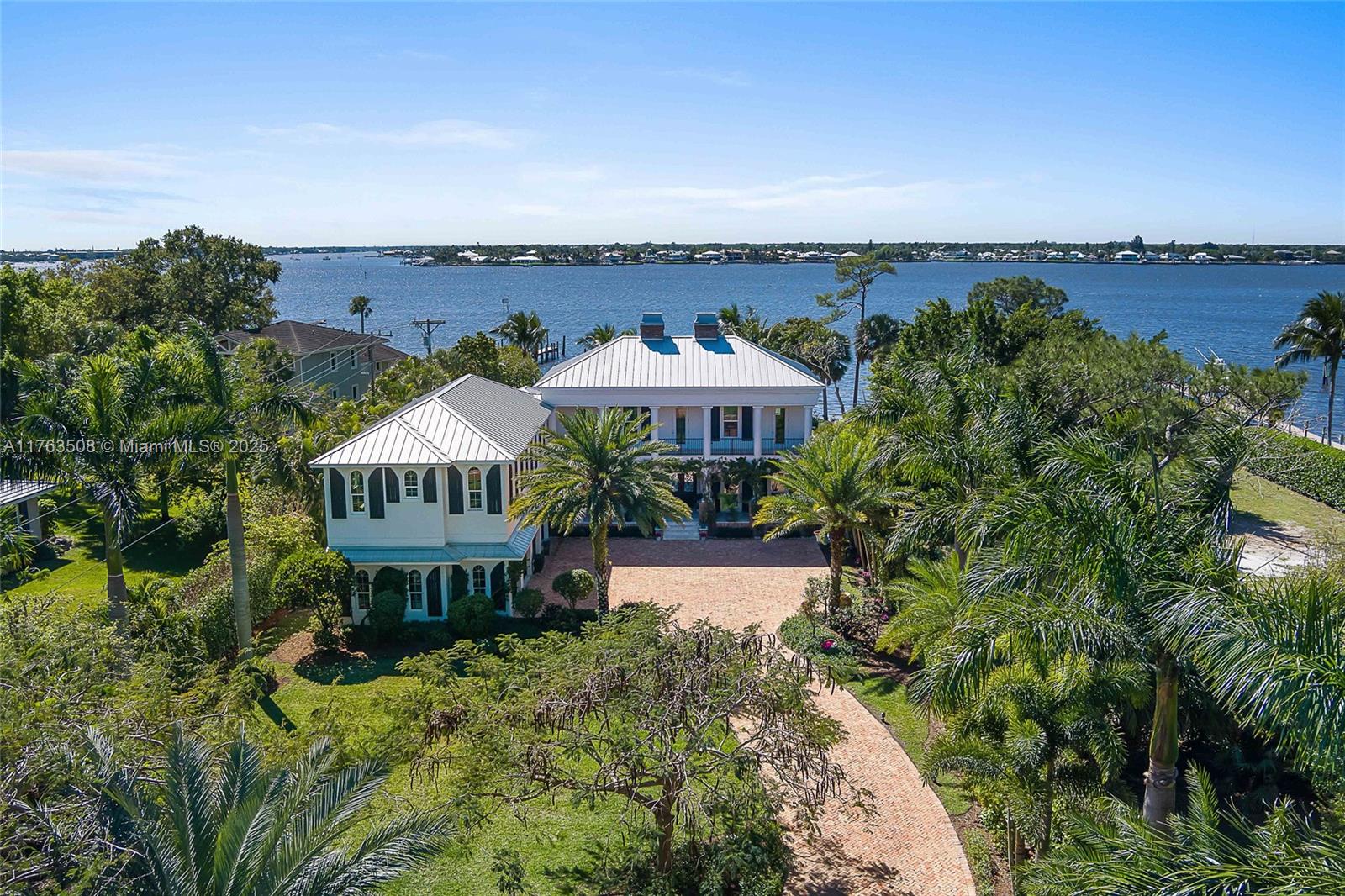 1350 Northwest Fork Road Stuart, FL 34994 - Photo 3 of 32 an aerial view of a house with garden space and a swimming pool