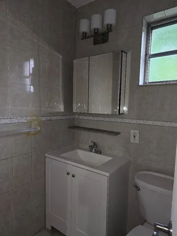 an empty room with a bench