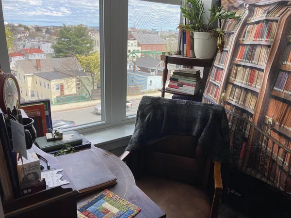 a bedroom with furniture and a book shelf