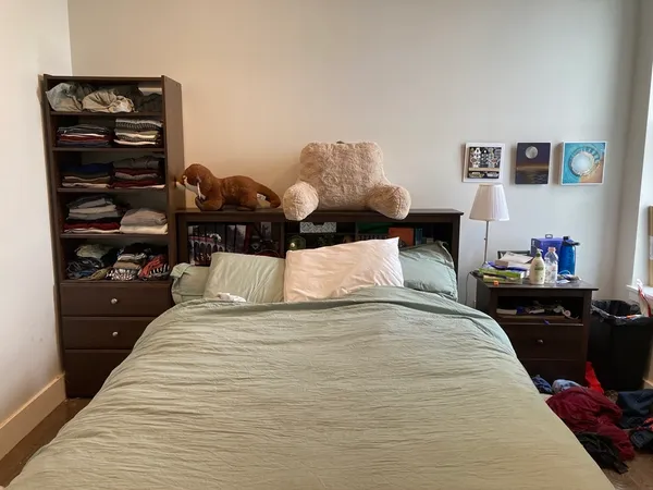 a room with two chair and a flat screen tv