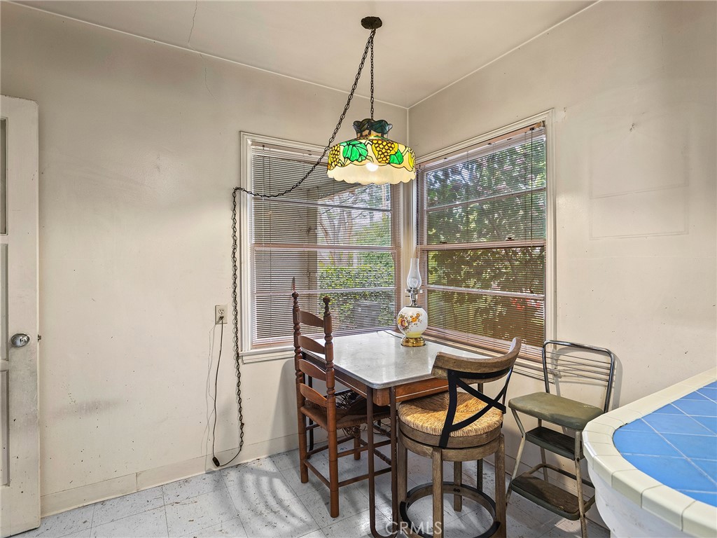 441 Dartmouth Road Burbank, CA 91504 - Photo 9 of 46 a dining room with furniture wooden floor and a chandelier