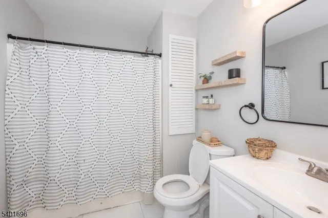 a bathroom with a toilet and a sink