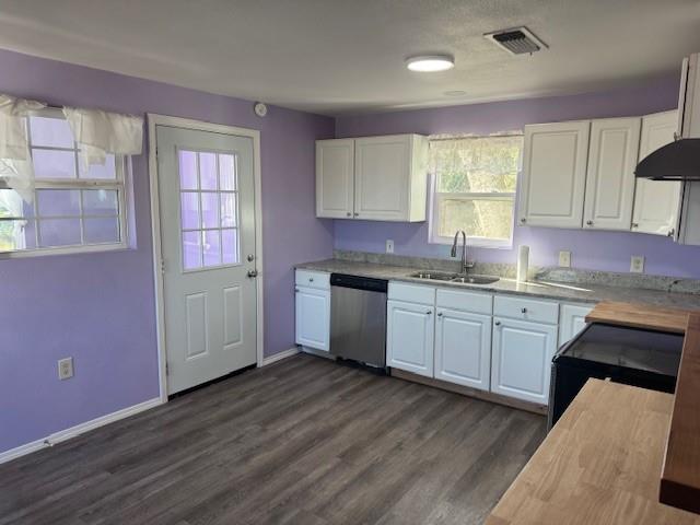 2032 Highway 338 Naples, TX 75568 - Photo 13 of 21 a kitchen with granite countertop a sink cabinets wooden floor and stainless steel appliances