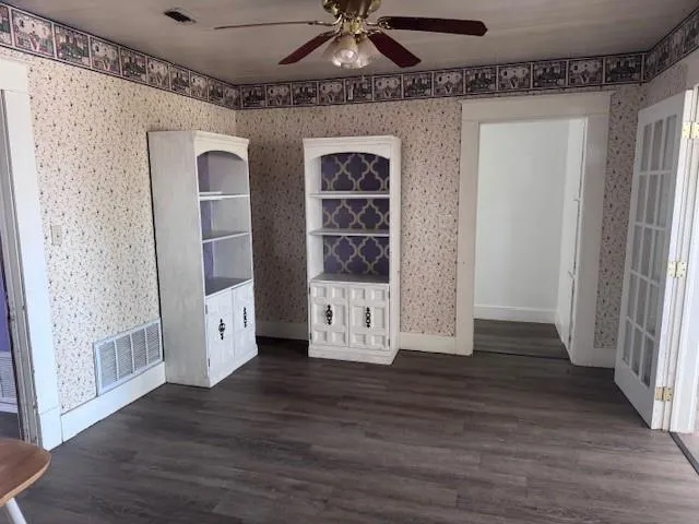 a view of an entryway with wooden floor