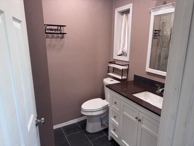 2032 Highway 338 Naples, TX 75568 - Photo 16 of 21 a bathroom with a granite countertop toilet sink and mirror